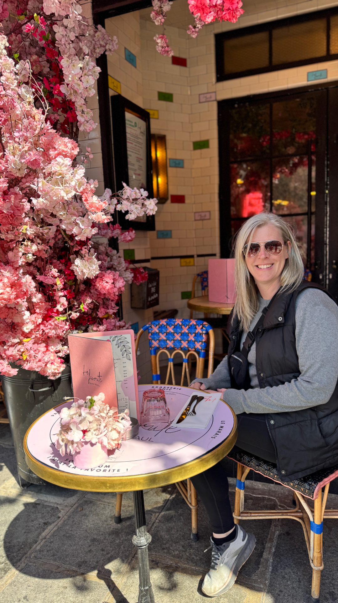 Travel advisor enjoying a café in Paris surrounded by cherry blossoms