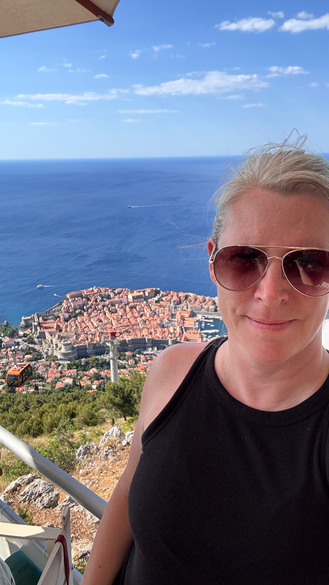 Travel advisor in Dubrovnik Croatia with scenic coastal city view showcasing firsthand Europe travel experience - Suite Impressions Travel